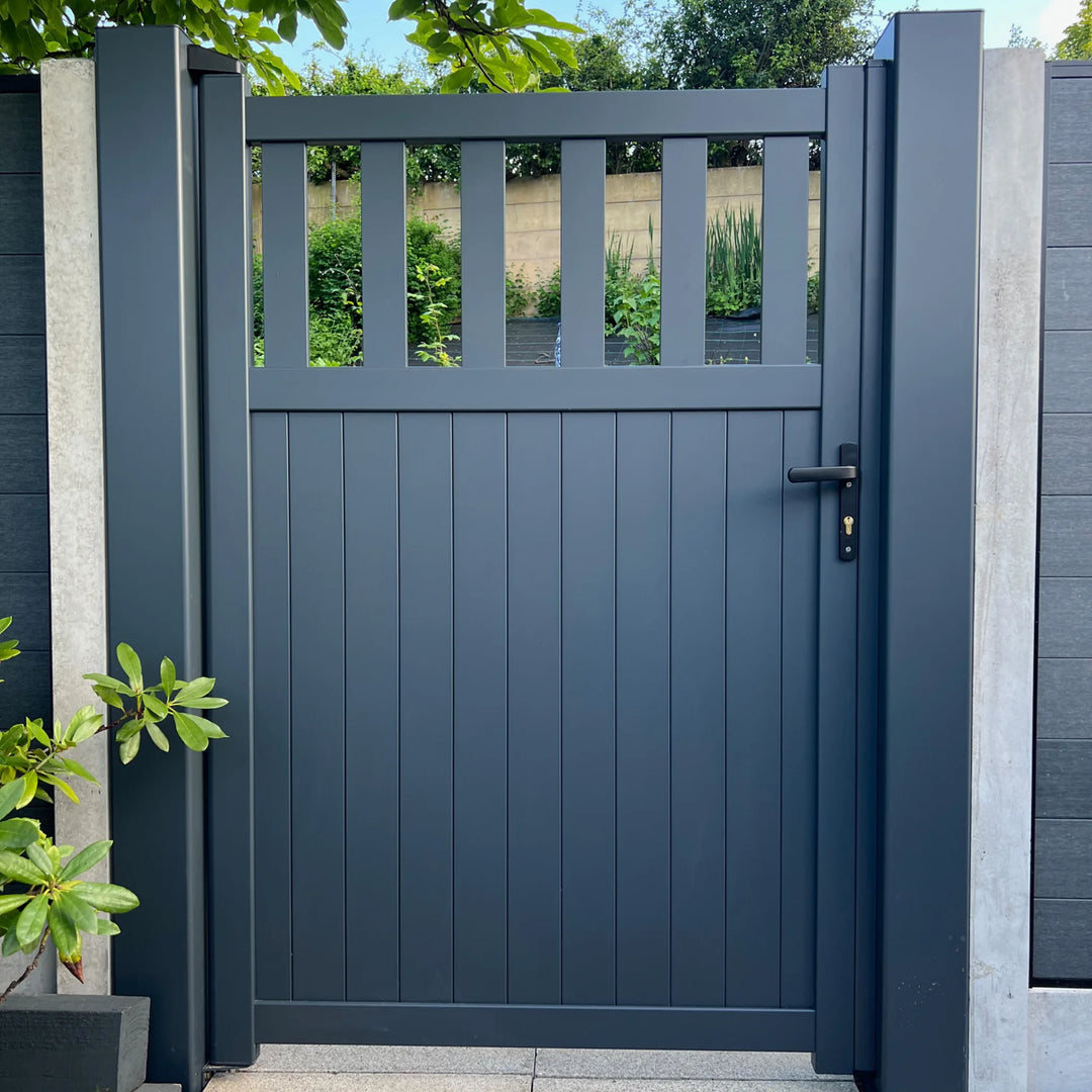 Anthracite grey open slatted aluminium garden gate installed between posts
